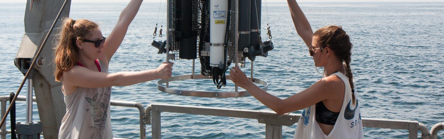 smsoe students working with equipment at sea
