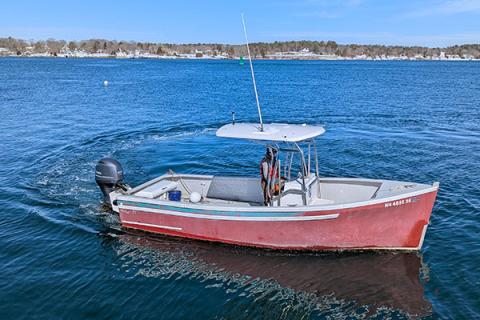 The small boat, Red Cloud, out on the water. 